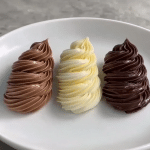 Rich, glossy chocolate ganache ready to use as a cake filling — dark, milk, and white chocolate versions.